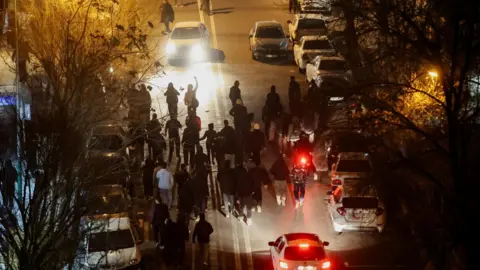 Protesters in Tehran on 8 January 2026 as authorities responded with lethal force