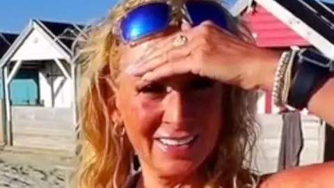 Kim on a West Sussex beach; she was approached by a man wearing smart sunglasses