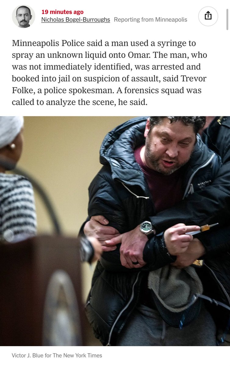 Security restrains a man accused of spraying an unknown liquid on Rep. Ilhan Omar at her Minneapolis town hall.