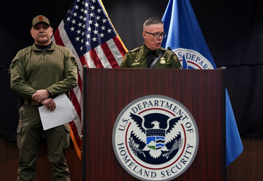 Federal officials speak at a press conference in Minneapolis amid an ICE enforcement surge.
