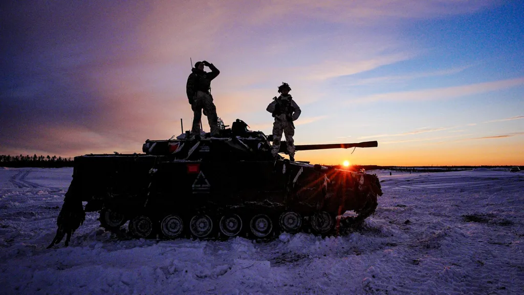 Estonian and British troops train during NATO exercises near the Russian border