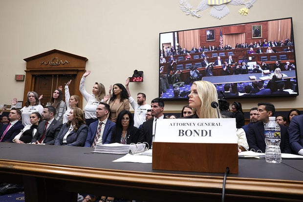 Survivors of Jeffrey Epstein stand as Attorney General Pam Bondi testifies before the House Judiciary Committee in Washington, D.C., on Feb. 11, 2026.