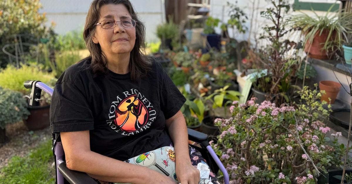 A woman at home, reflecting the challenges Medicaid enrollees face finding dentists who accept coverage.