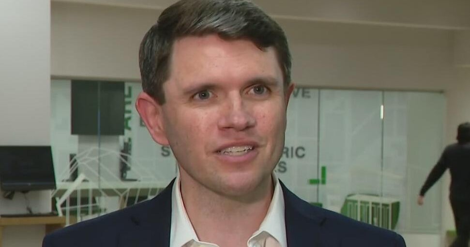 A close-up of a lawmaker speaking during a televised interview.