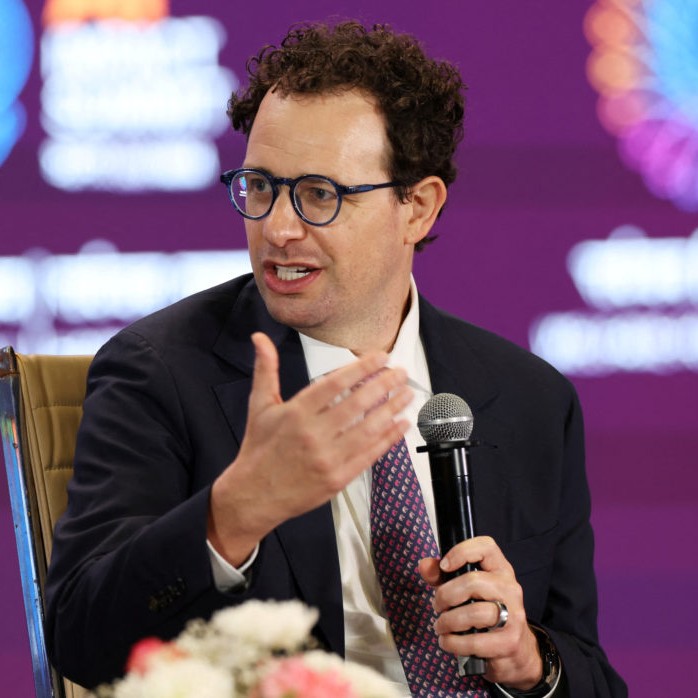 Left: Anthropic CEO Dario Amodei, addresses the gathering at the AI Impact Summit, in New Delhi, India, Feb. 19, 2026. Photo by Bhawika Chhabra/Reuters - Bhawika Chhabra/Reuters