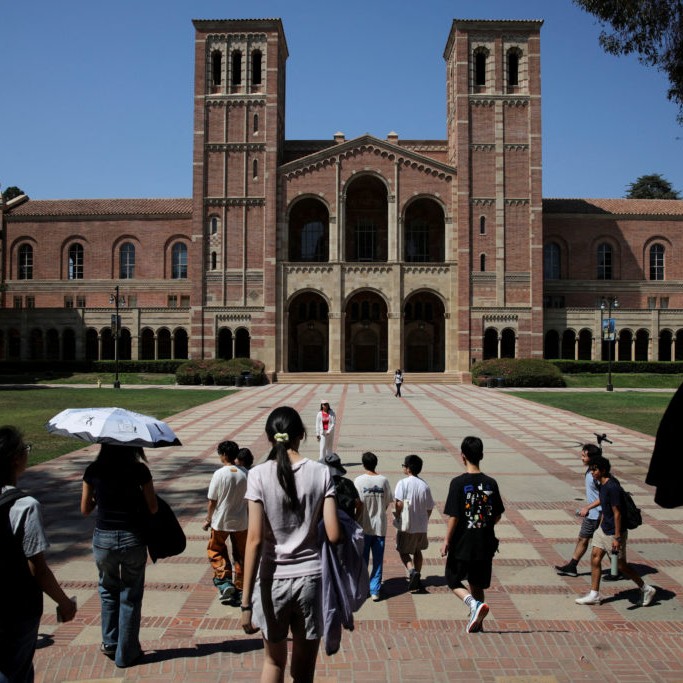 FILE PHOTO: People walk through the campus of the University of California Los Angeles (UCLA) in Los Angeles - Daniel Cole/Reuters