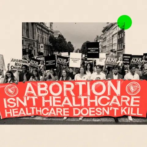 Protesters hold a large red sign reading 'Abortion isn't healthcare. Healthcare doesn't kill people.' in a stylized black-and-white crowd scene.
