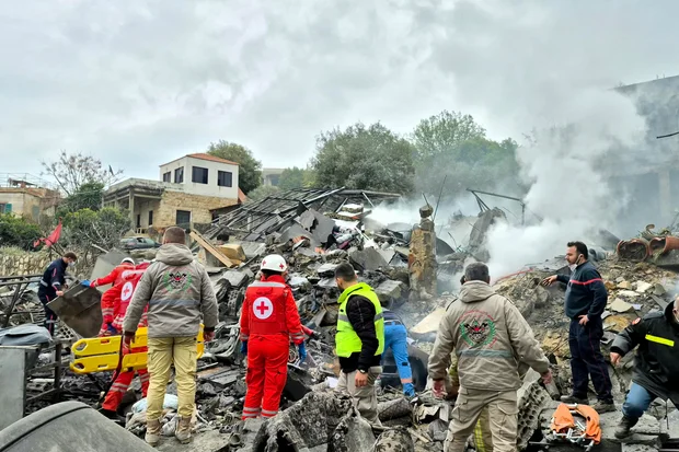 First aid responders at the site of an Israeli airstrike in Kfar Roummane, southern Lebanon, March 26, 2026.