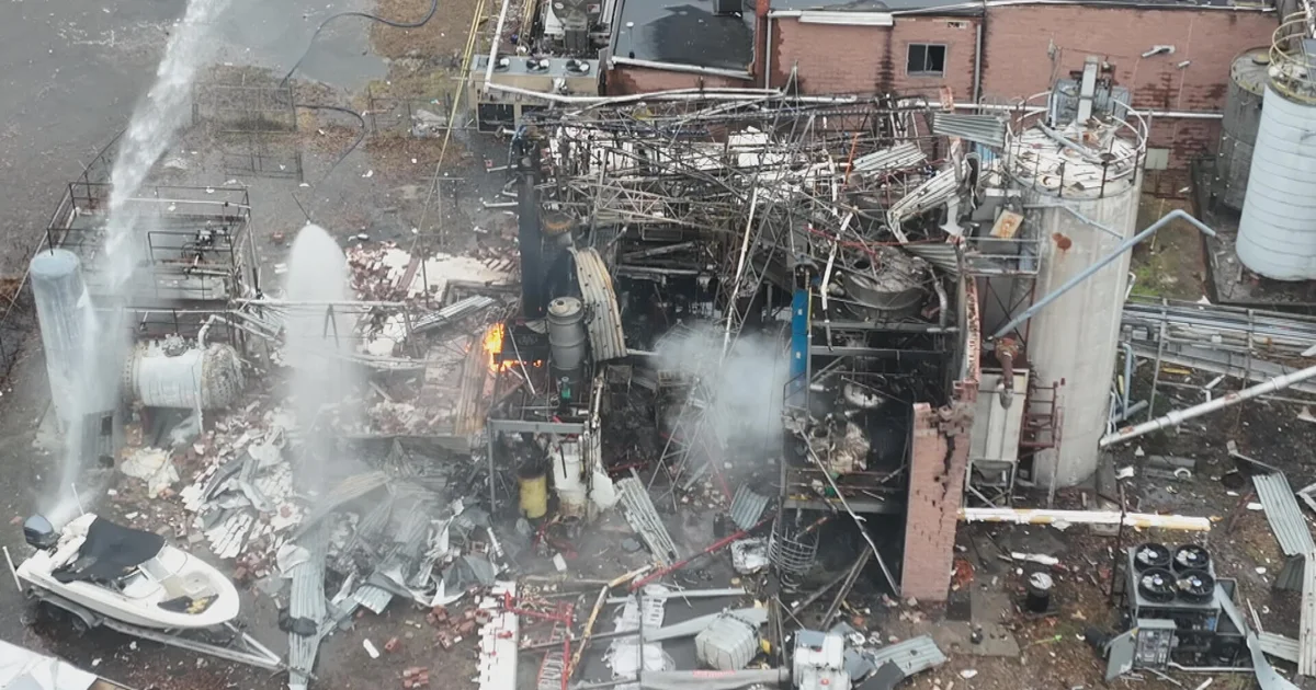 Aerial view of emergency response and damage after an explosion (illustrative; not the Oslo scene)