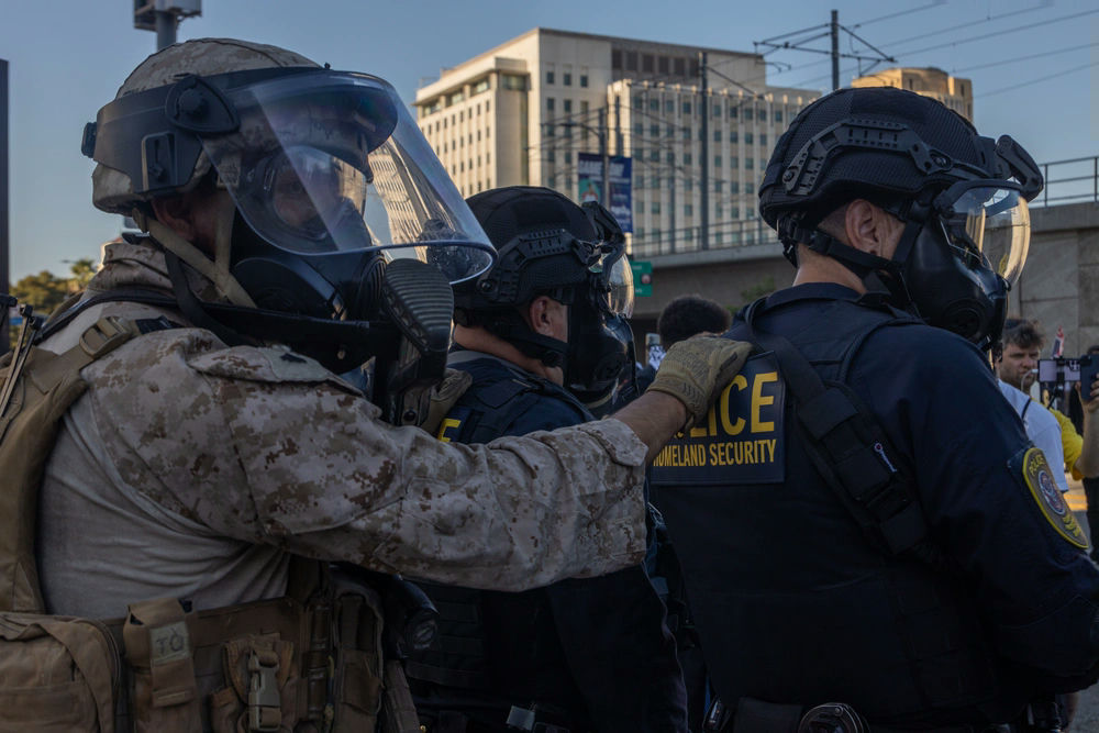 Armored police officers in formation during Ecuador's security sweep