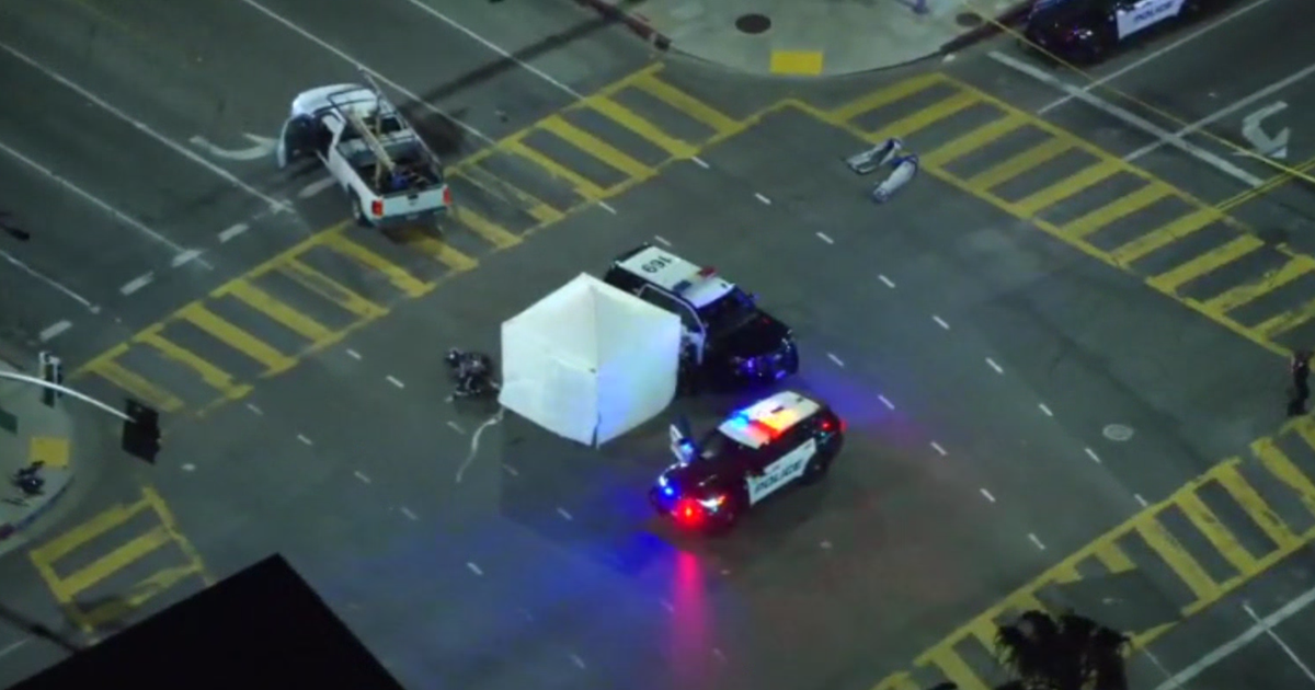 Overhead view of investigators and police vehicles at the crash response site near Washington, D.C.
