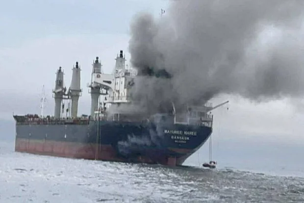 The cargo ship Mayuree Naree engulfed in smoke in the Strait of Hormuz, March 11, 2026. (Royal Thai Navy/Handout via Reuters)