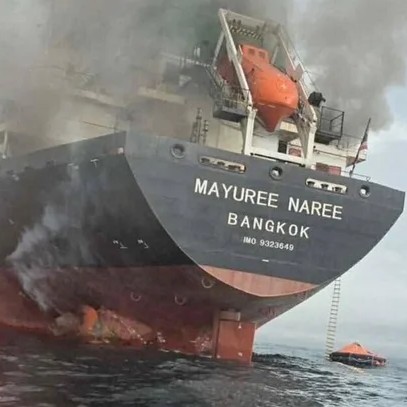 The Thailand-flagged cargo ship Mayuree Naree is seen engulfed in smoke in the Strait of Hormuz, March 11, 2026. ROYAL THAI NAVY/Handout/REUTERS - CBS