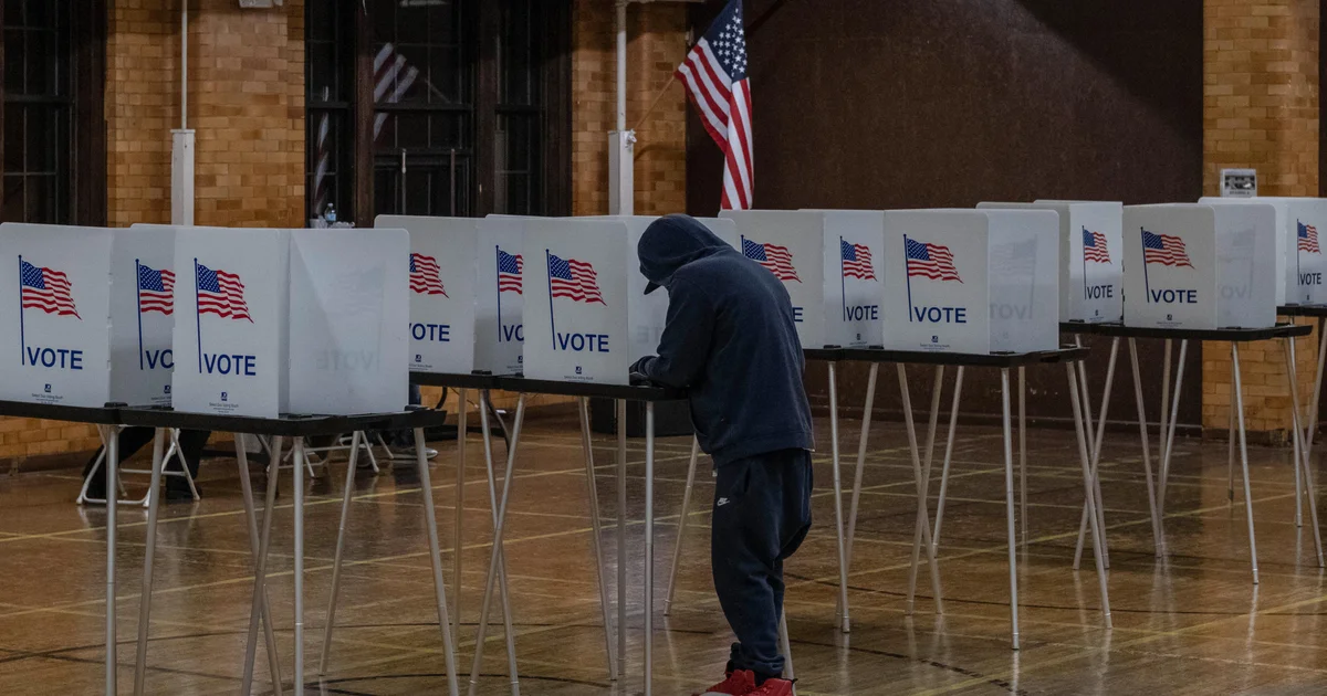 A voter fills out a ballot at a voting booth in Georgia.