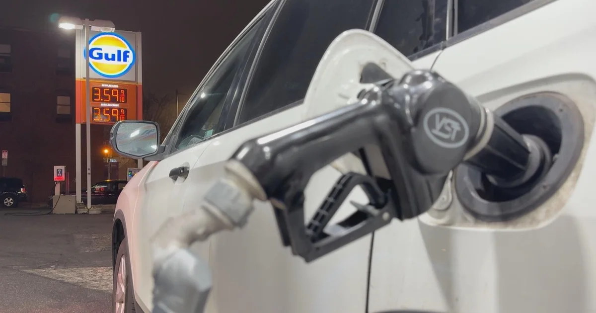 Gas nozzle in a car at a service station amid a jump in fuel costs.