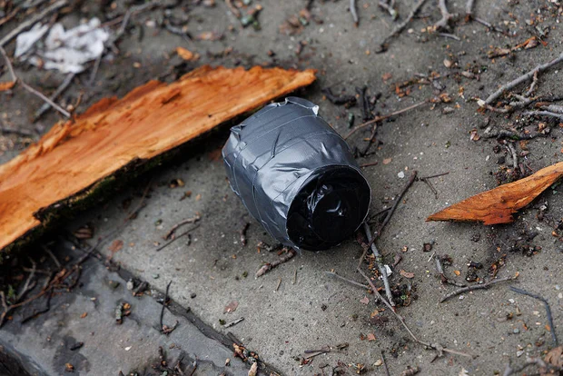 A homemade explosive device lies on the ground during the protest outside Gracie Mansion.