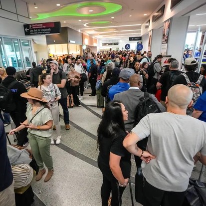 Airline passengers wait in long lines to get through TSA screening at William P. Hobby Airport in Houston, Sunday, March 8, 2026. Brett Coomer/Houston Chronicle via AP. - Brett Coomer/Houston Chronicle via AP