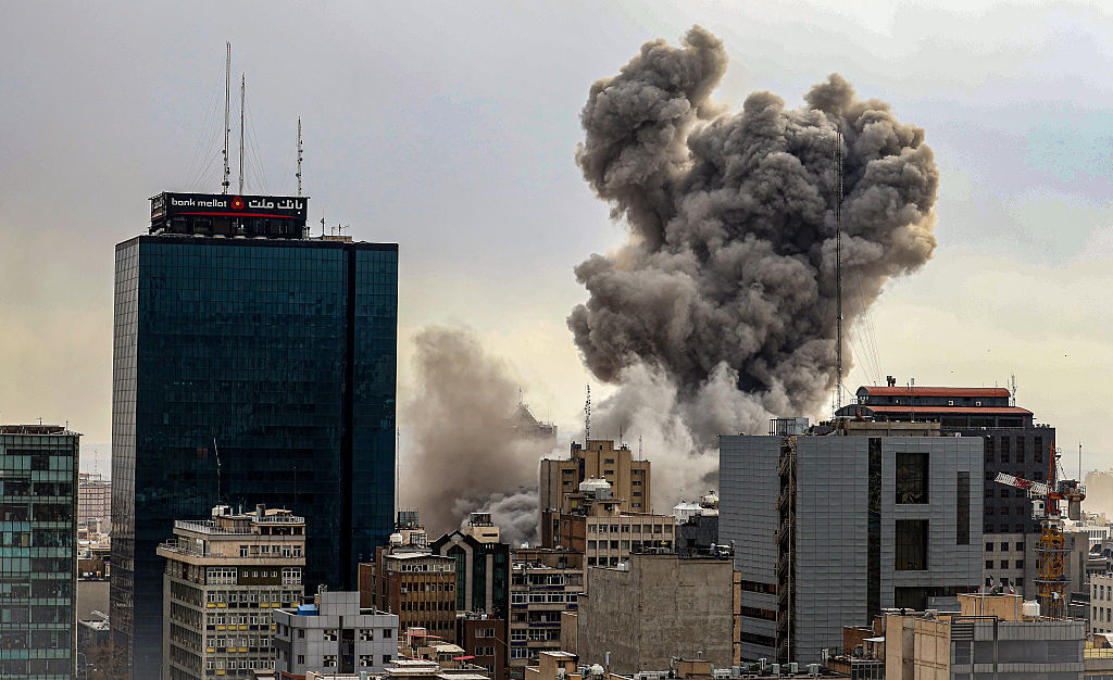 File photo: an explosion plume rises over a city skyline, used illustratively for air attack concerns.
