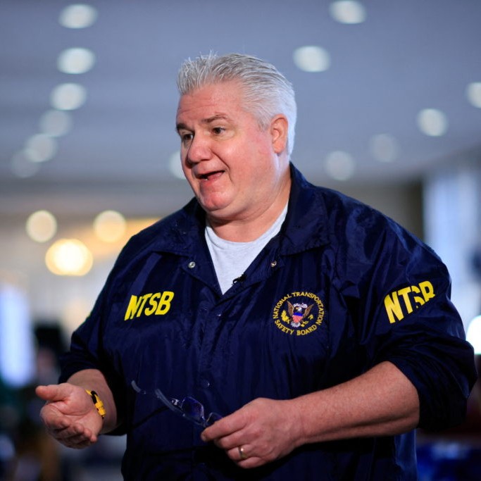 Left: National Transportation Safety Board member Todd Inman speaks with a journalist, in the aftermath of the collision of American Eagle flight 5342 and a Black Hawk helicopter that crashed into the Potomac River, at Ronald Reagan Washington National Airport, in Arlington, Virginia, Jan. 31, 2025. File photo by Eduardo Munoz/Reuters - Eduardo Munoz/Reuters