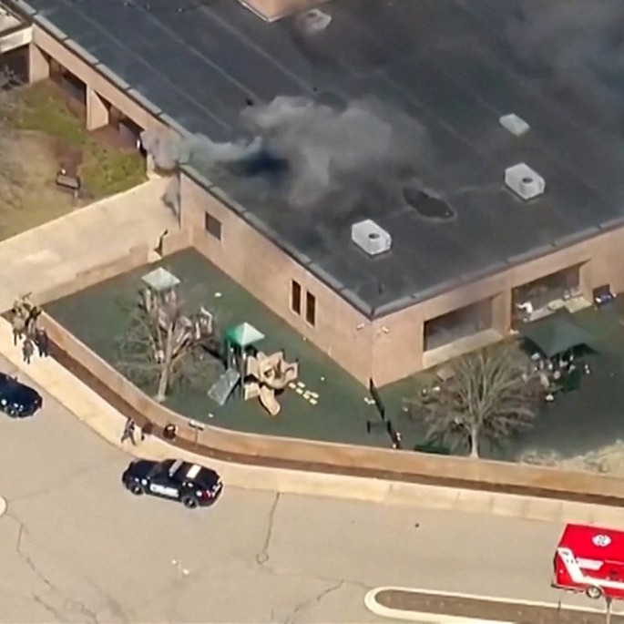 Left: Smoke rises from the building after the Michigan State Police reported an active shooting incident at the Temple Israel Synagogue in West Bloomfield, Michigan, U.S., March 12, 2026 in a still image from video. Photo by ABC Affiliate WXYZ via Reuters - ABC Affiliate WXYZ via Reuters