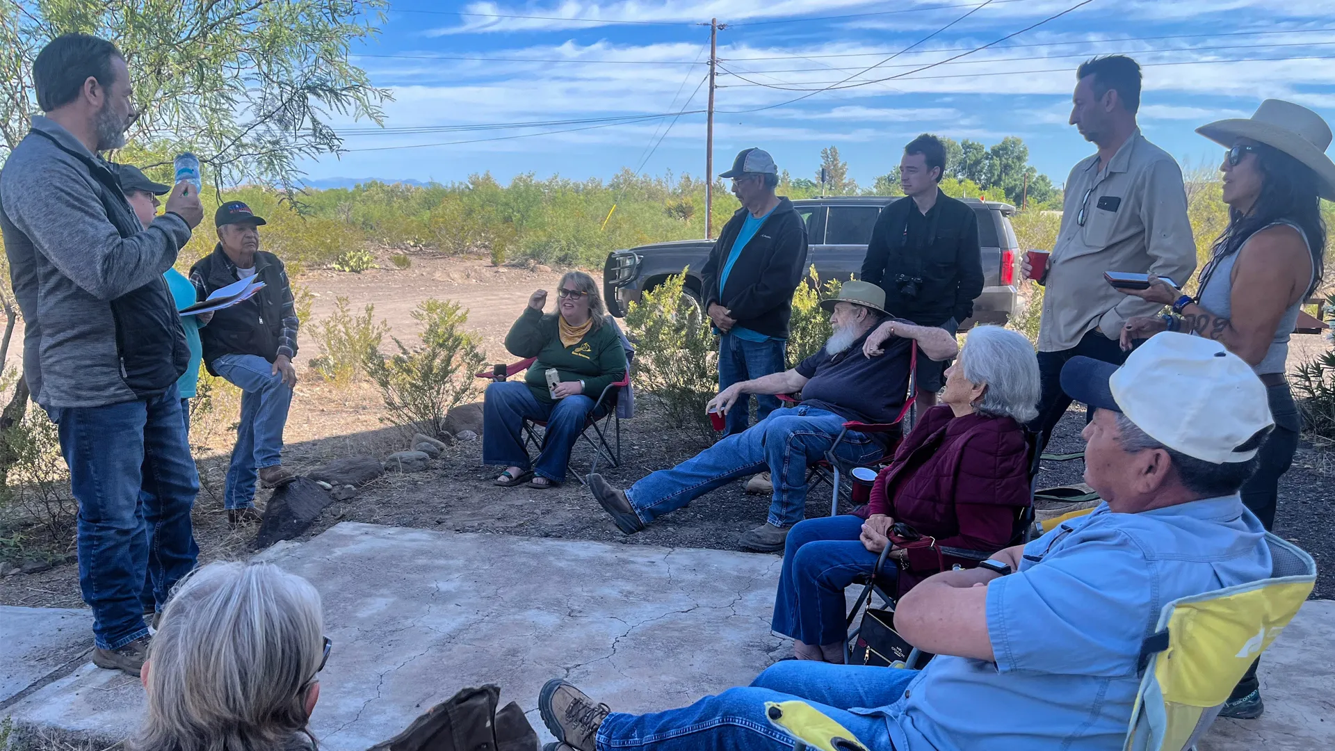 Landowners in Redford, Texas listen to Army Corps of Engineers representatives during a field meeting.