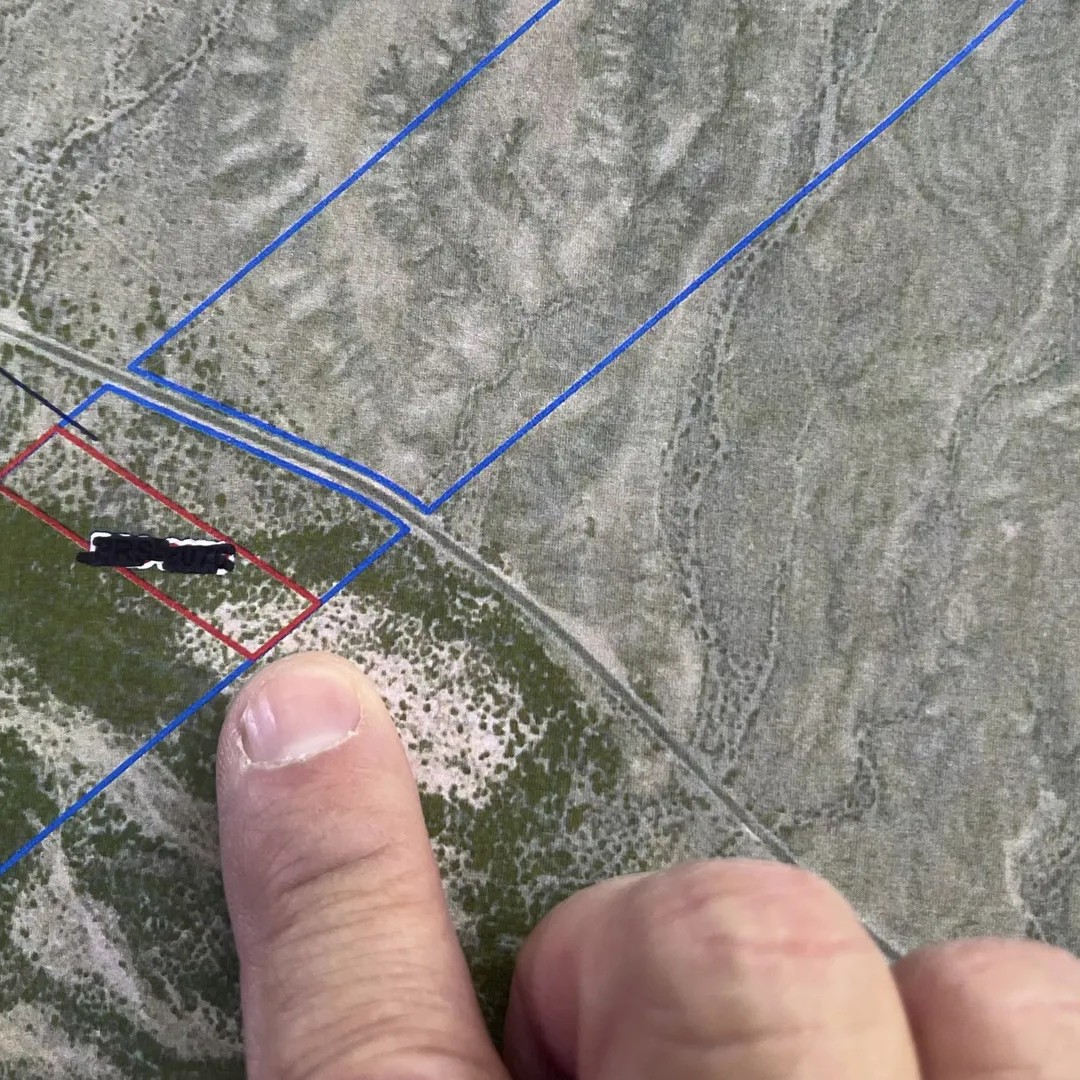 This CAD map close up shows incomplete and inaccurate property lines of landowner. If the construction outlined in red continued across the whole property it appears that the wall would run through the owner's home. Photo: Brittany Gibson for Axios - Brittany Gibson for Axios