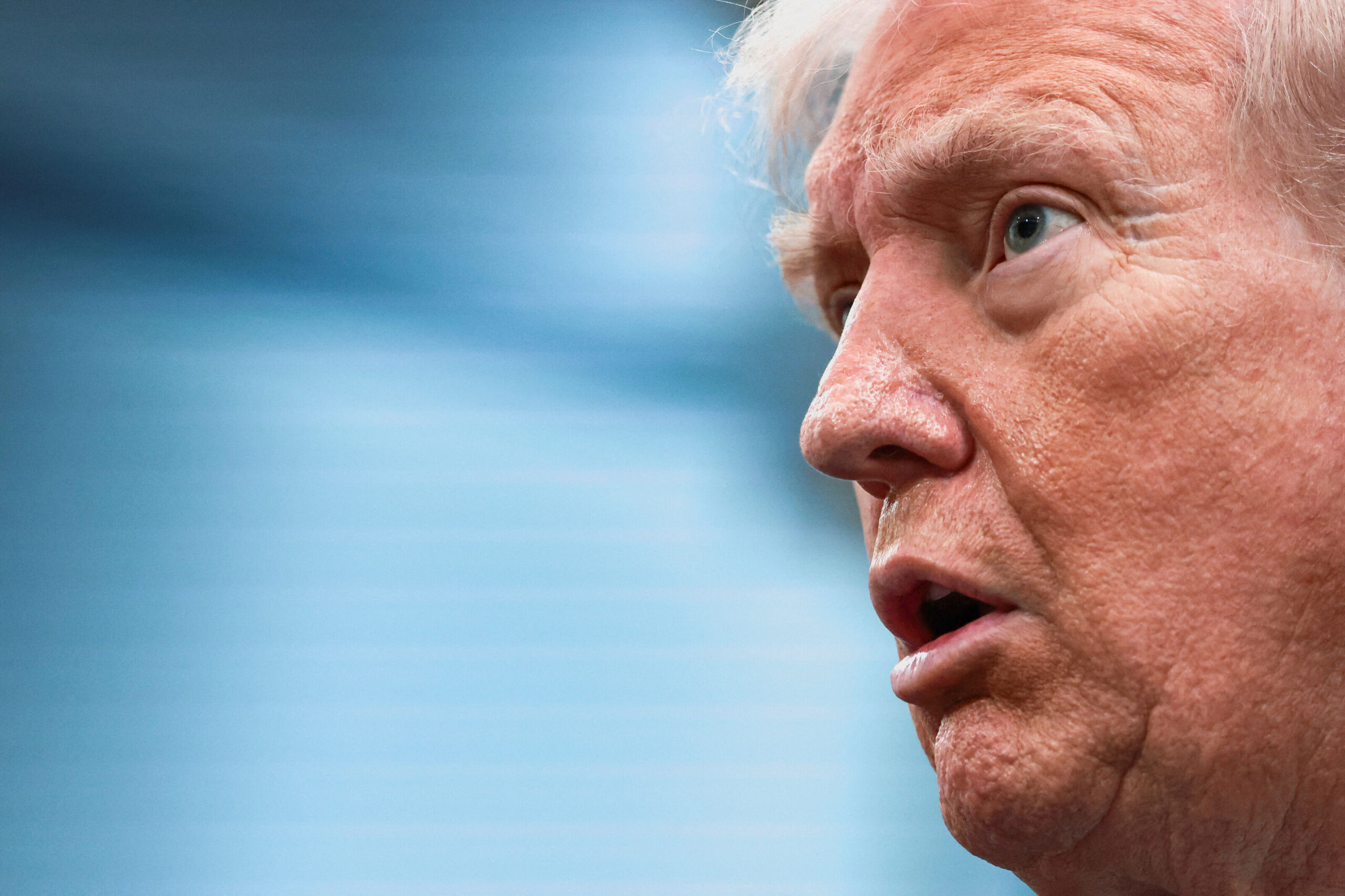 Former President Donald Trump speaking during a public appearance.