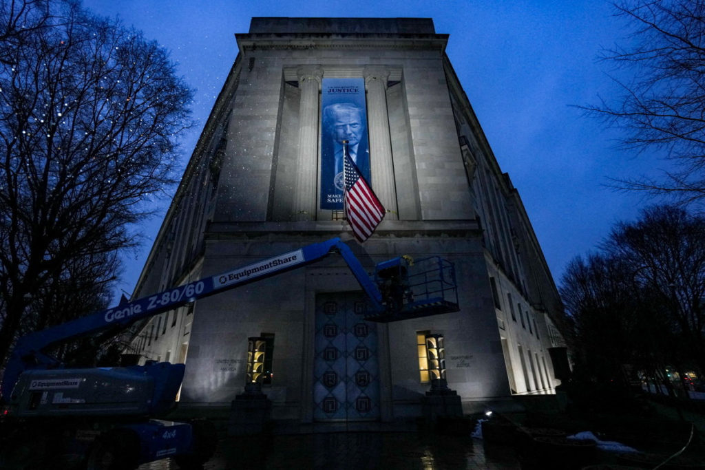 A large banner of President Donald Trump on the Department of Justice building in Washington, D.C.