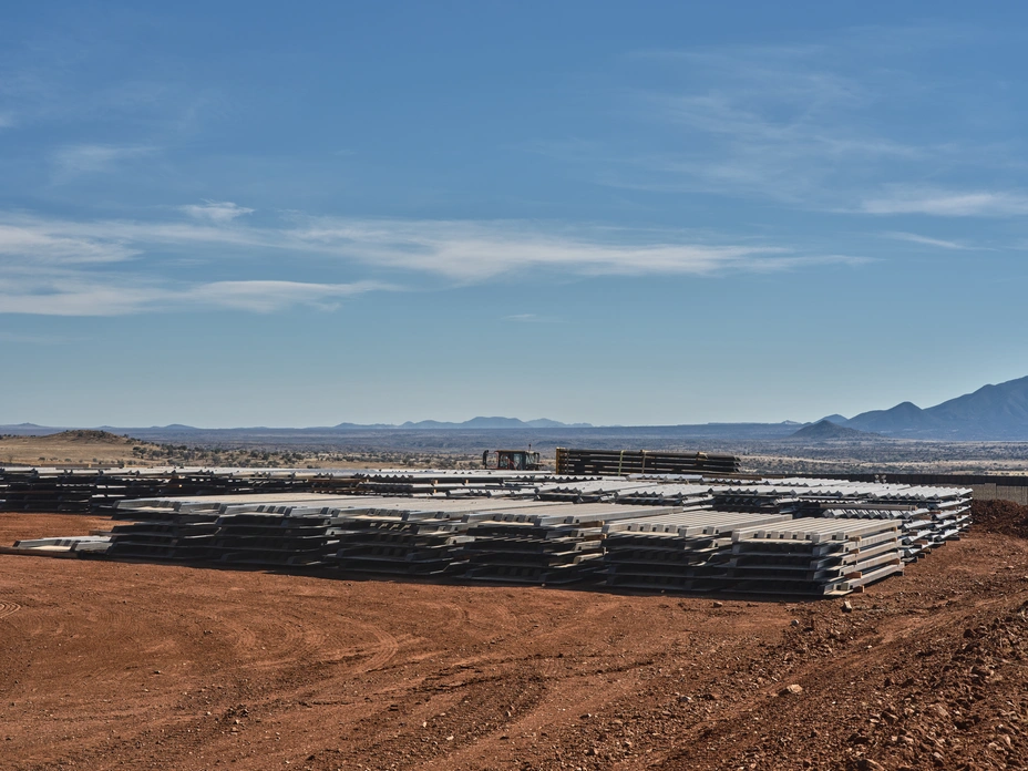 Stacks of steel bollard panels waiting for installation in the San Rafael Valley.